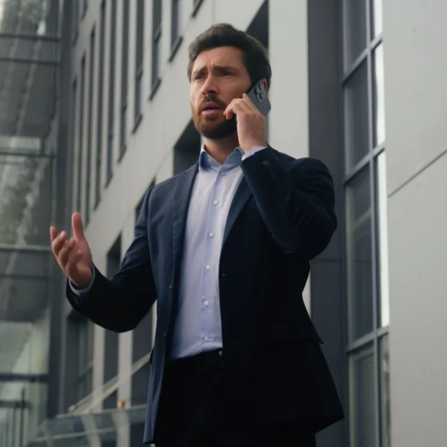 Man on the phone, finding out his attorney is dishonest