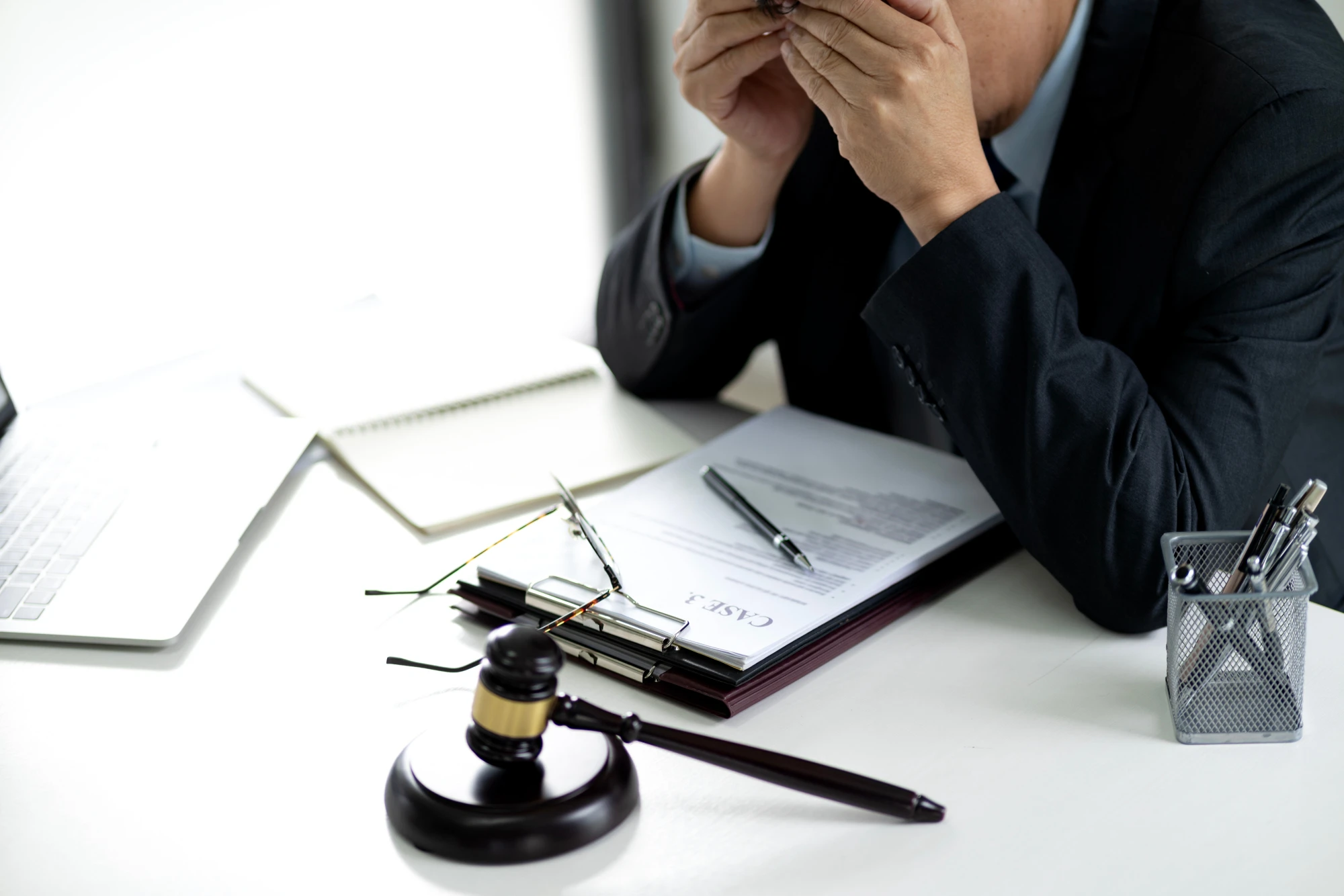 Texas attorney with his head in his hands