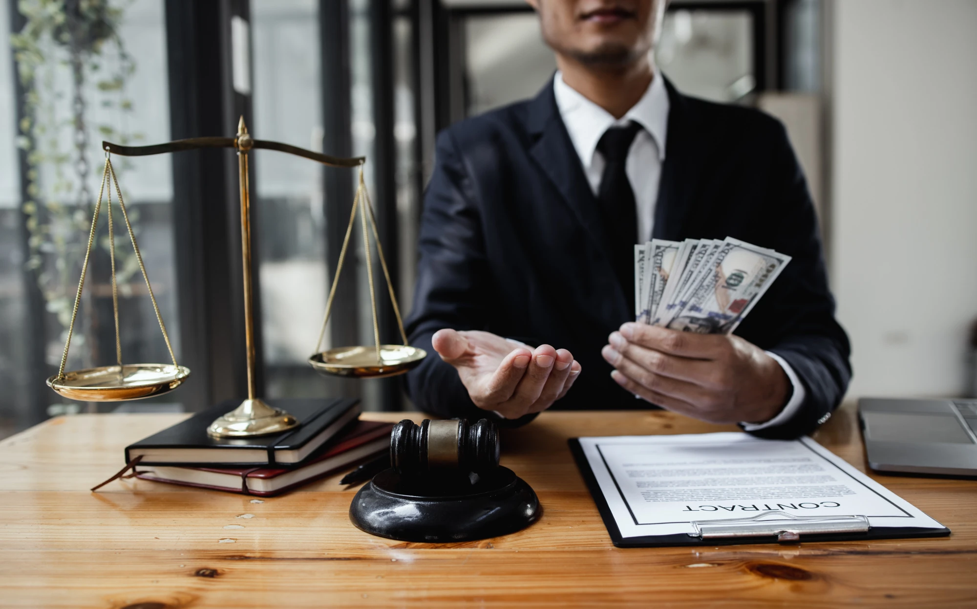Texas lawyer holding a wad of cash