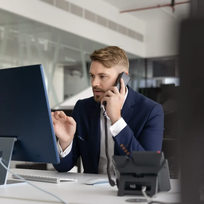 Serious businessman on the phone firing his attorney before trial