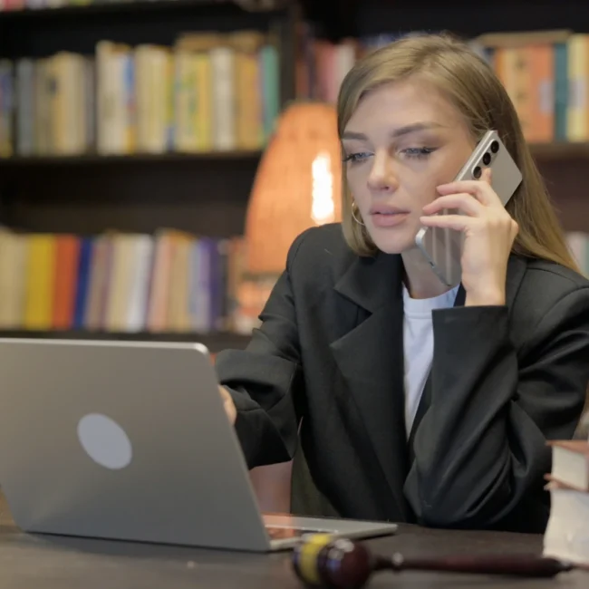 Female attorney on the phone, soliciting a client after an accident in Texas
