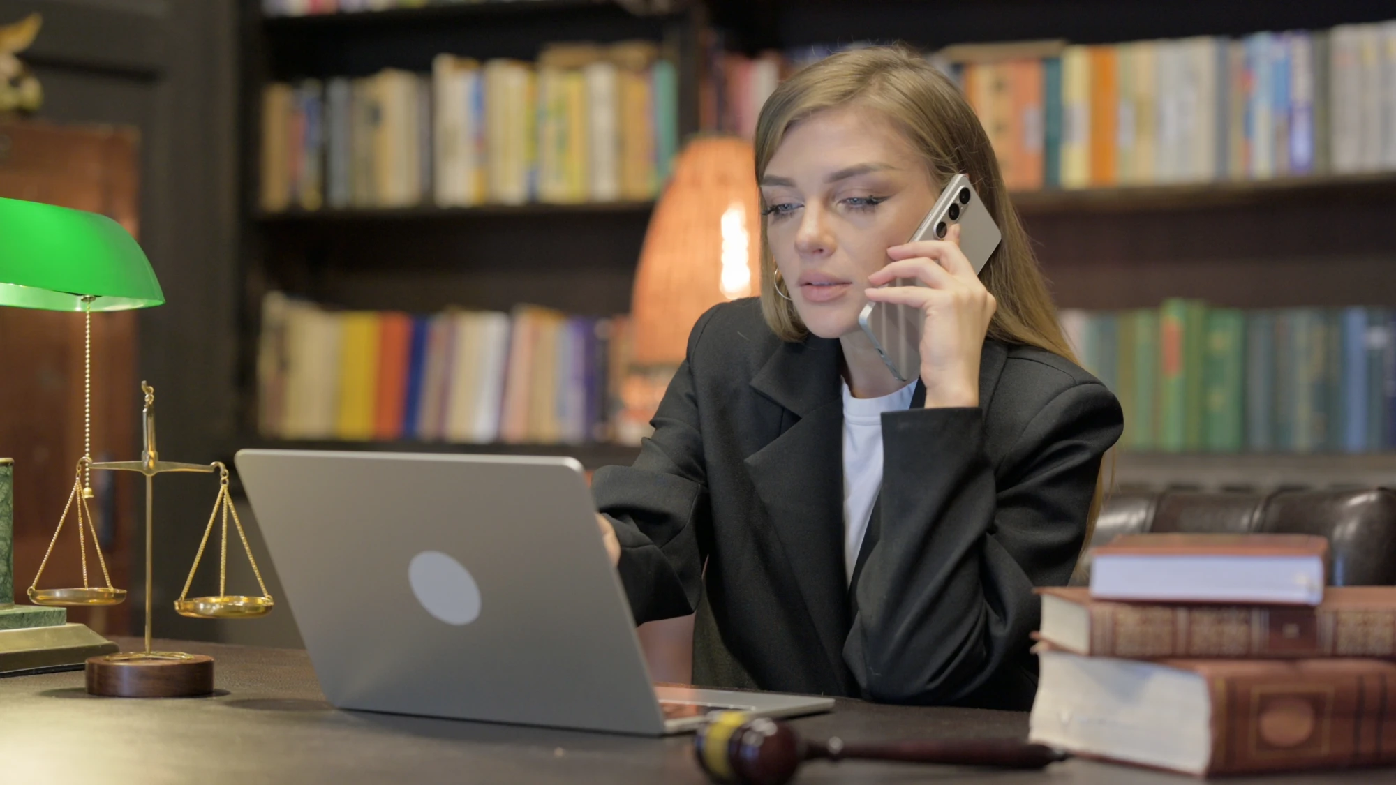 Female attorney on the phone, soliciting a client after an accident in Texas